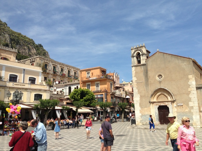 A main square in Taormina is filled with beauty as well as tourists.  